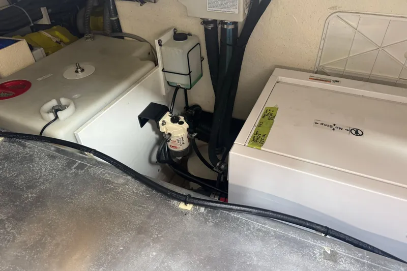  Yacht Photos Pics Engine compartment of 2022 De Antonio Yachts D42 Open, showcasing mechanical components and wiring.