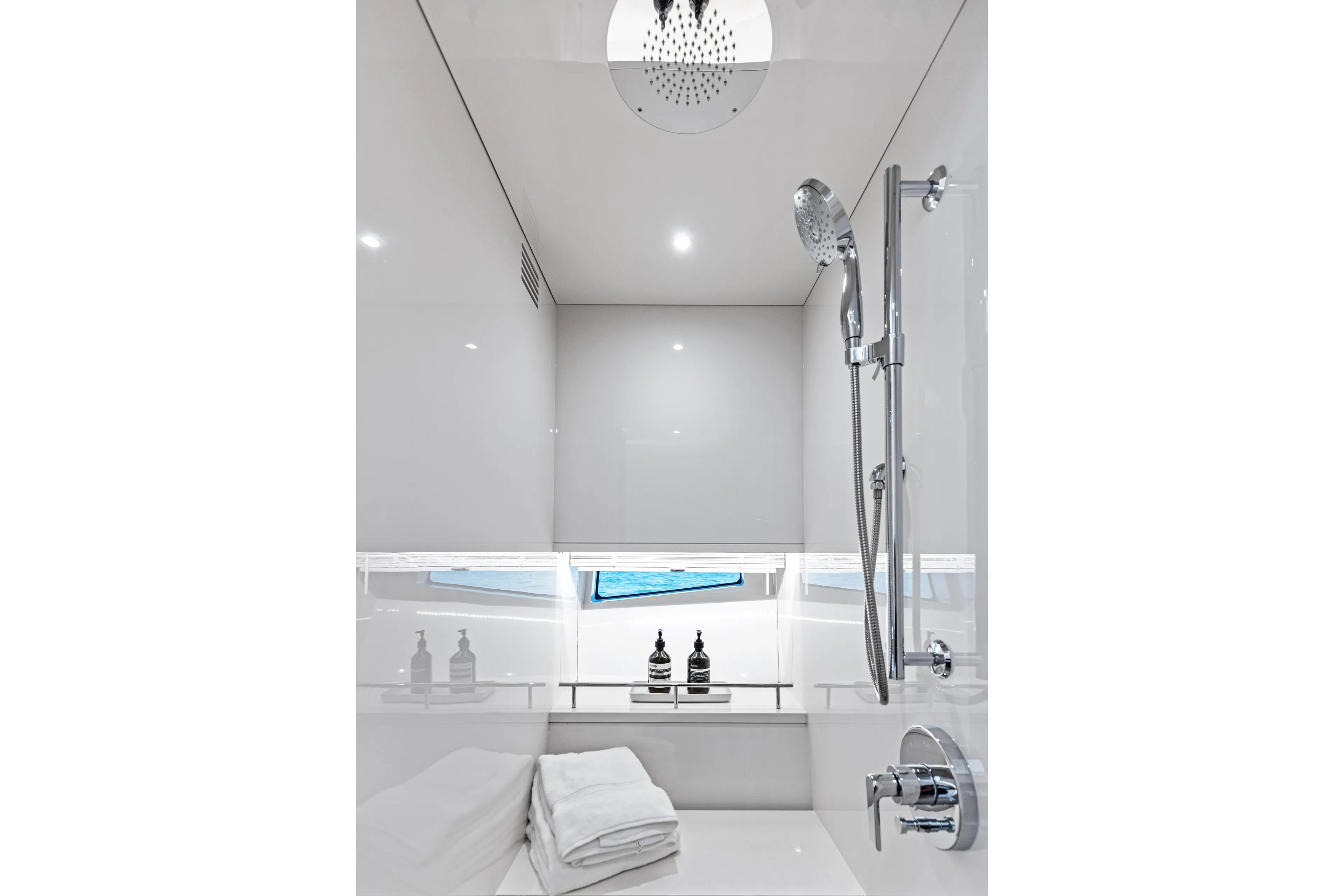  Yacht Photos Pics Luxurious bathroom interior of 2026 Scout 670 LXS yacht with modern shower fixtures.