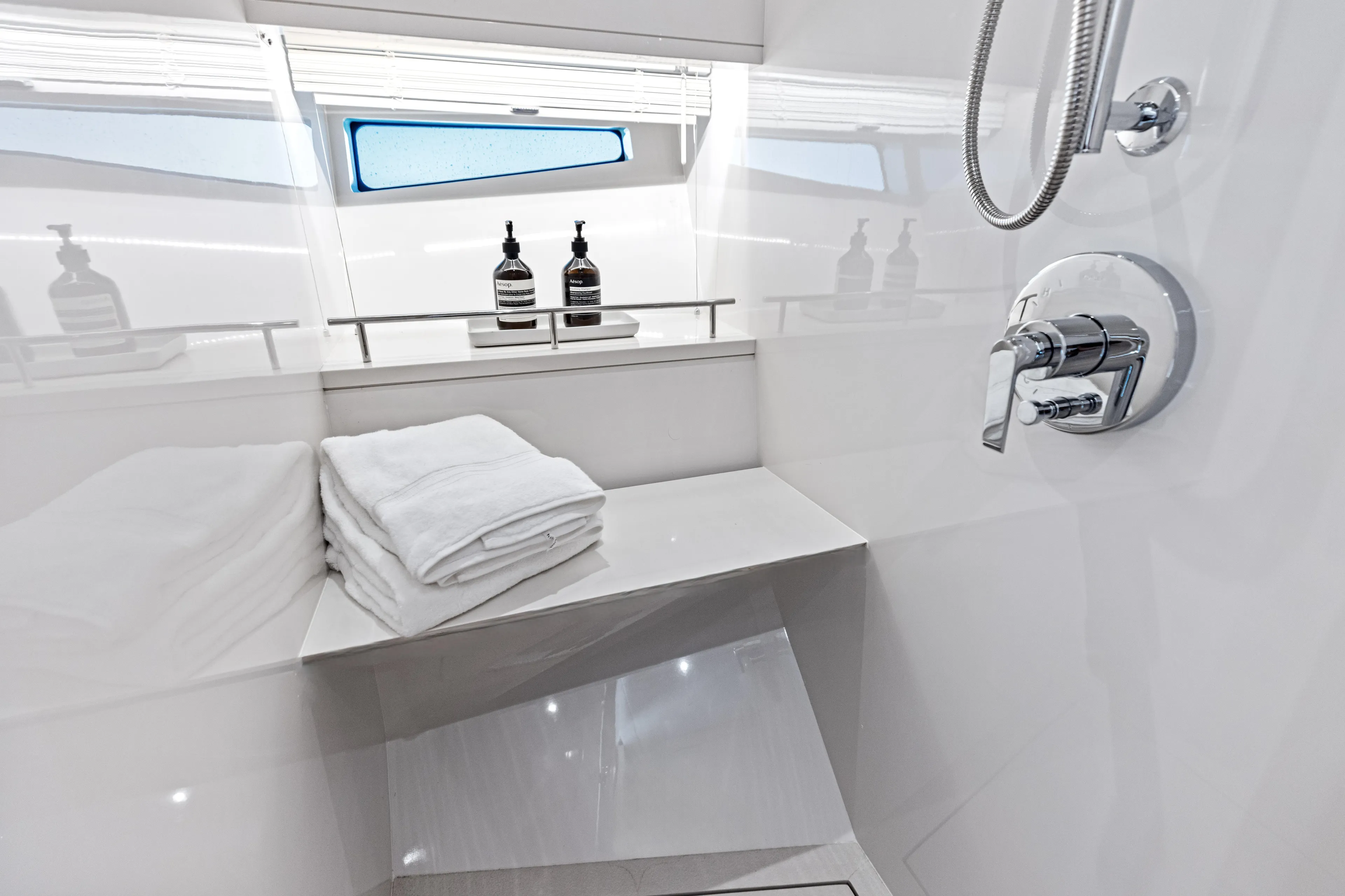  Yacht Photos Pics Luxurious bathroom interior of 2026 Scout 670 LXS yacht with modern fixtures.
