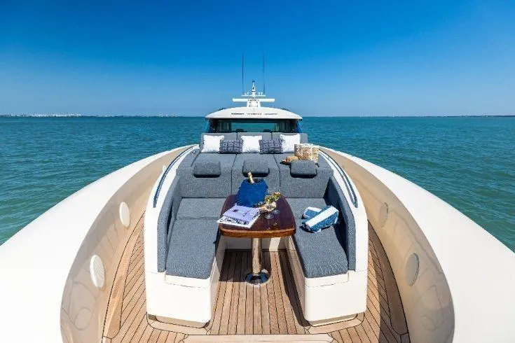  Yacht Photos Pics Luxurious 2026 Scout 670 LXS yacht with elegant deck seating on open water.