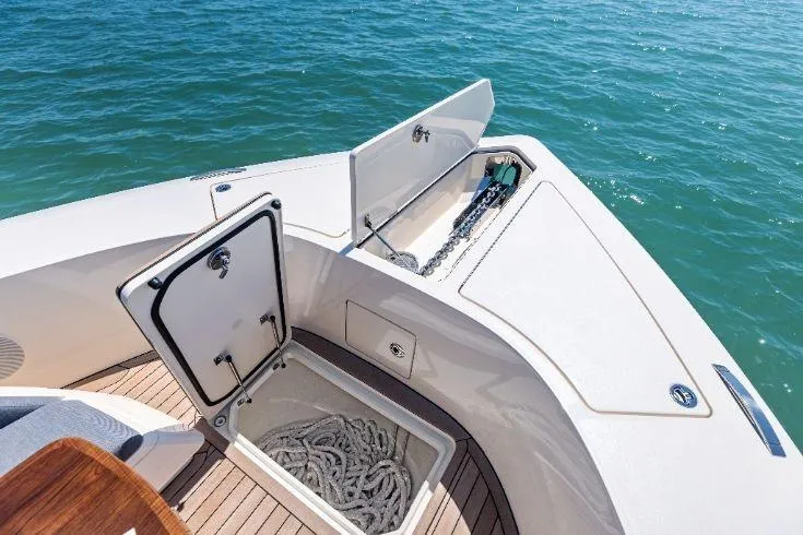  Yacht Photos Pics Bow storage compartments on 2026 Scout 670 LXS boat, featuring anchor and rope.