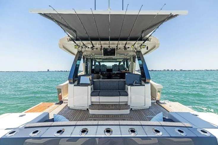  Yacht Photos Pics 2026 Scout 670 LXS luxury yacht on open water, showcasing spacious deck and seating.