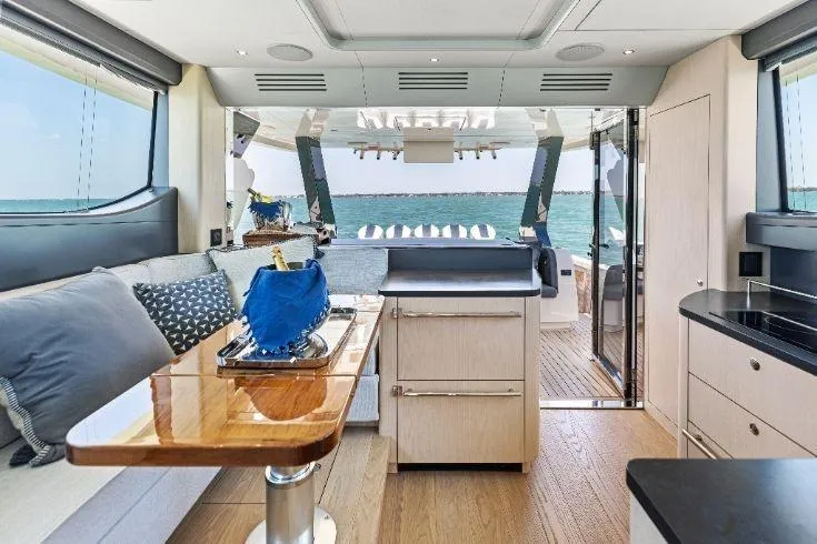  Yacht Photos Pics Luxurious interior of 2026 Scout 670 LXS yacht with ocean view and modern amenities.