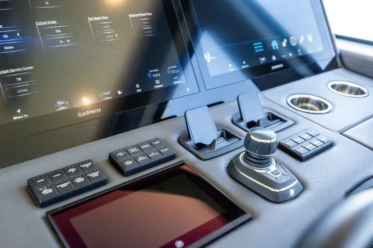  Yacht Photos Pics 2026 Scout 670 LXS boat dashboard with advanced Garmin navigation displays and controls.