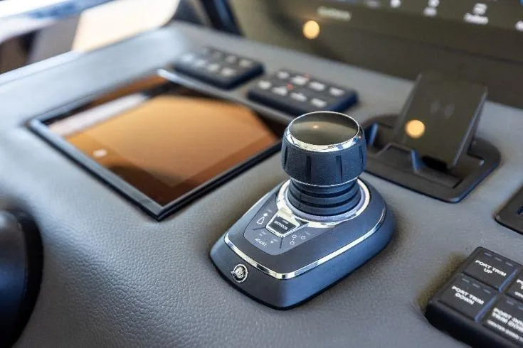 Yacht Photos Pics Control panel of 2026 Scout 670 LXS boat with joystick and touchscreen.