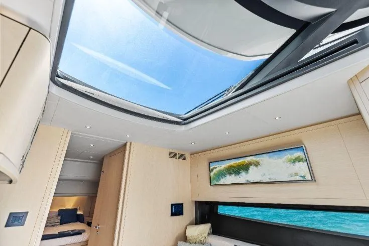  Yacht Photos Pics Luxurious interior of 2026 Scout 670 LXS yacht with skylight and ocean view.