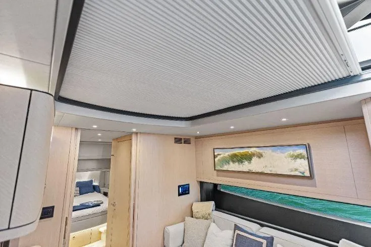  Yacht Photos Pics Luxurious interior of 2026 Scout 670 LXS yacht with modern design and cozy seating.