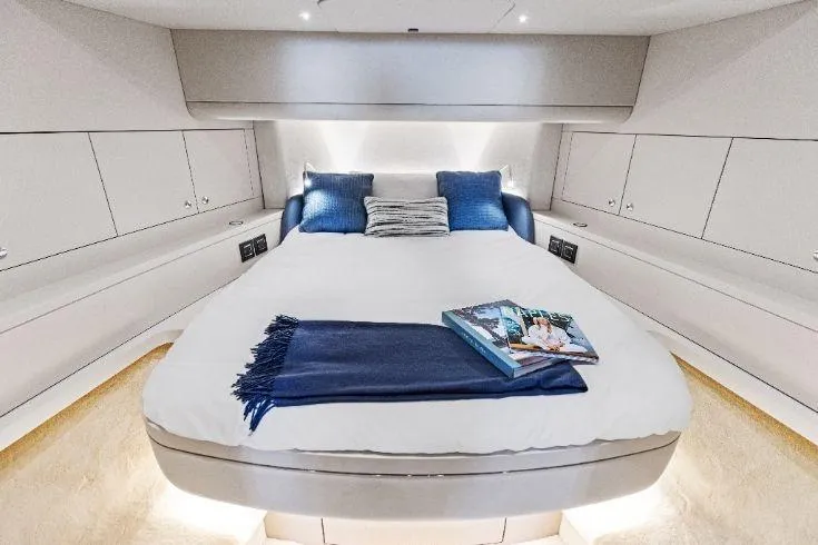  Yacht Photos Pics Luxurious 2026 Scout 670 LXS yacht cabin with cozy bed and elegant decor.