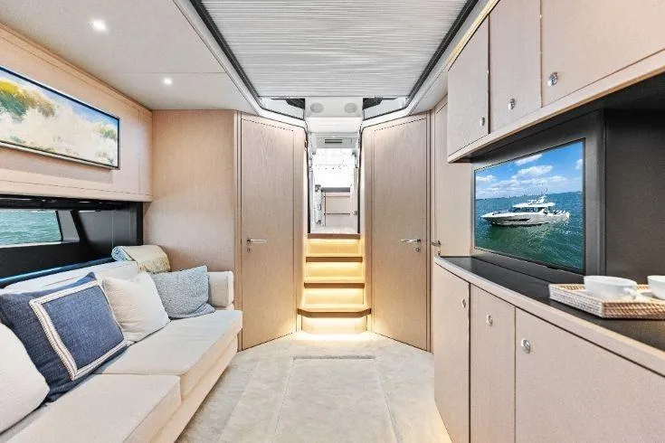  Yacht Photos Pics Luxurious interior of 2026 Scout 670 LXS yacht with modern decor and entertainment system.