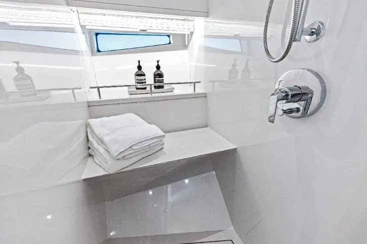  Yacht Photos Pics Luxurious bathroom in 2026 Scout 670 LXS yacht with modern fixtures and towels.