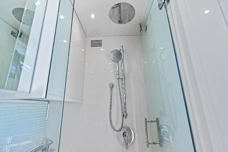  Yacht Photos Pics Modern shower in 2026 Scout 670 LXS yacht, featuring sleek chrome fixtures and glass enclosure.