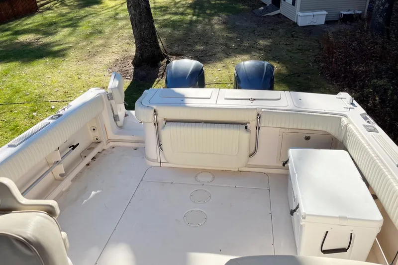 Revelry Yacht Photos Pics 2003 Grady-White Express 330 boat interior with seating and storage compartments.