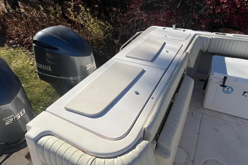 Revelry Yacht Photos Pics 2003 Grady-White Express 330 boat with Yamaha 250 engines and cushioned seating.