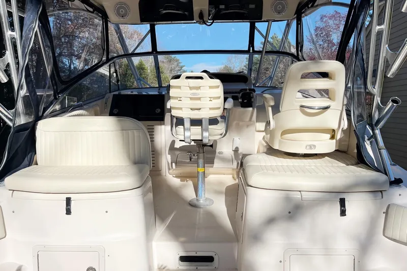 Revelry Yacht Photos Pics 2003 Grady-White Express 330 boat interior with seating and helm station.