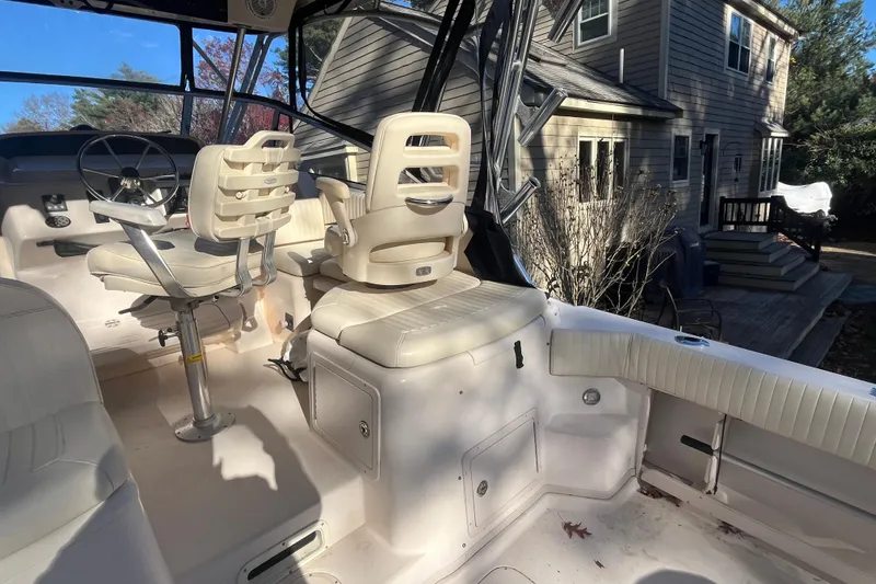 Revelry Yacht Photos Pics 2003 Grady-White Express 330 boat interior with helm and seating area.