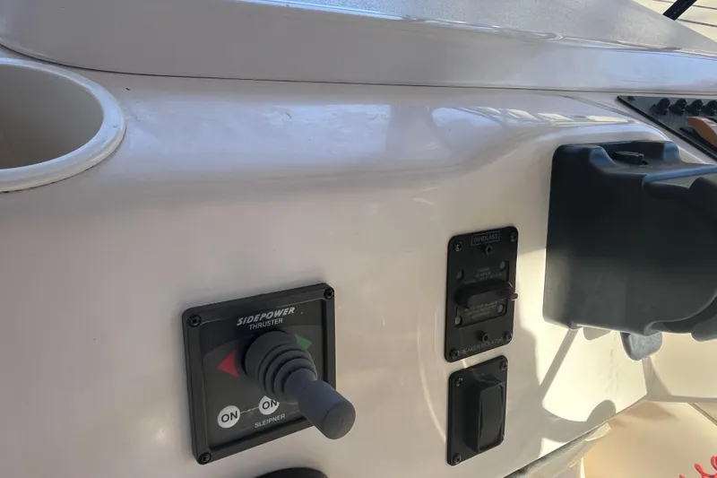 Revelry Yacht Photos Pics Control panel of a 2003 Grady-White Express 330 boat with thruster and windlass switches.