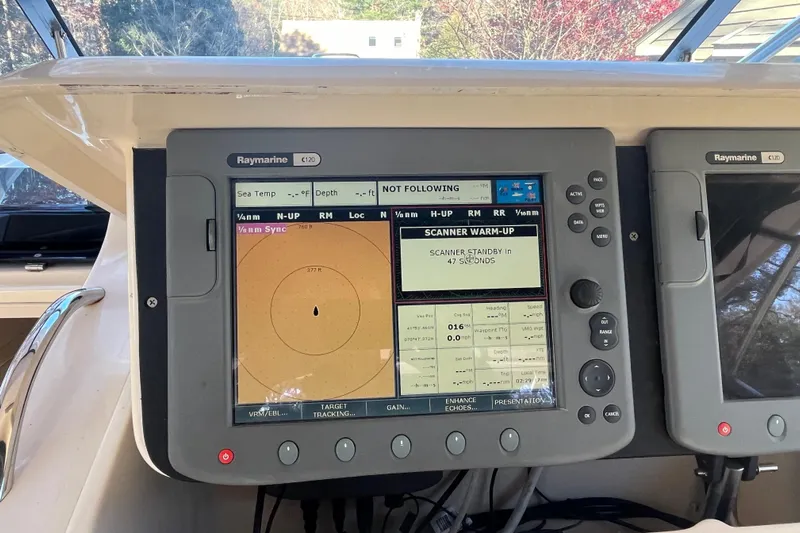 Revelry Yacht Photos Pics Raymarine C120 display on 2003 Grady-White Express 330 boat, showing navigation and radar settings.