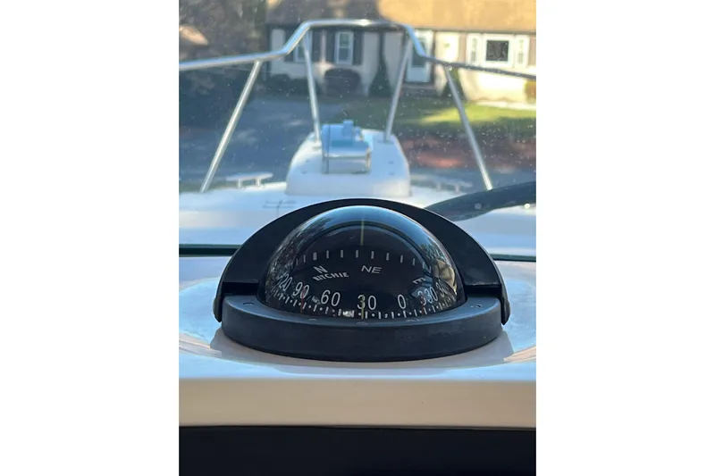 Revelry Yacht Photos Pics Compass on 2003 Grady-White Express 330 boat, showing northeast direction.