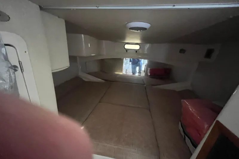 Revelry Yacht Photos Pics Interior cabin of 2003 Grady-White Express 330 boat, featuring cozy sleeping area.