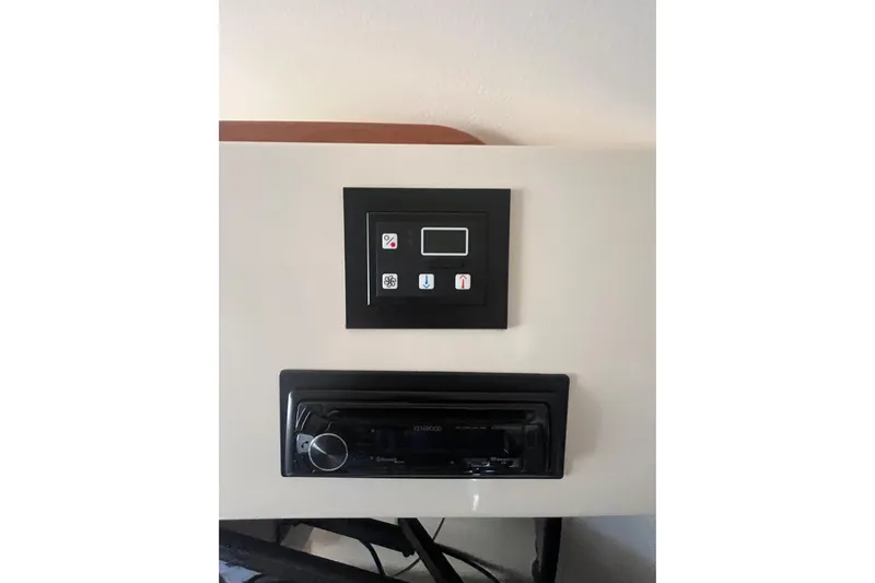 Revelry Yacht Photos Pics Control panel and stereo system on a 2003 Grady-White Express 330 boat.