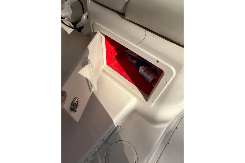 Revelry Yacht Photos Pics Open storage compartment on 2003 Grady-White Express 330 boat, revealing interior contents.