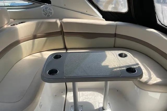 Seahorse Yacht Photos Pics Interior of 2007 Chaparral 330 Signature boat with cushioned seating and table.