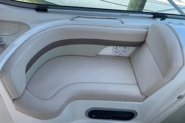 Seahorse Yacht Photos Pics 2007 Chaparral 330 Signature boat interior seating with beige upholstery and built-in speaker.