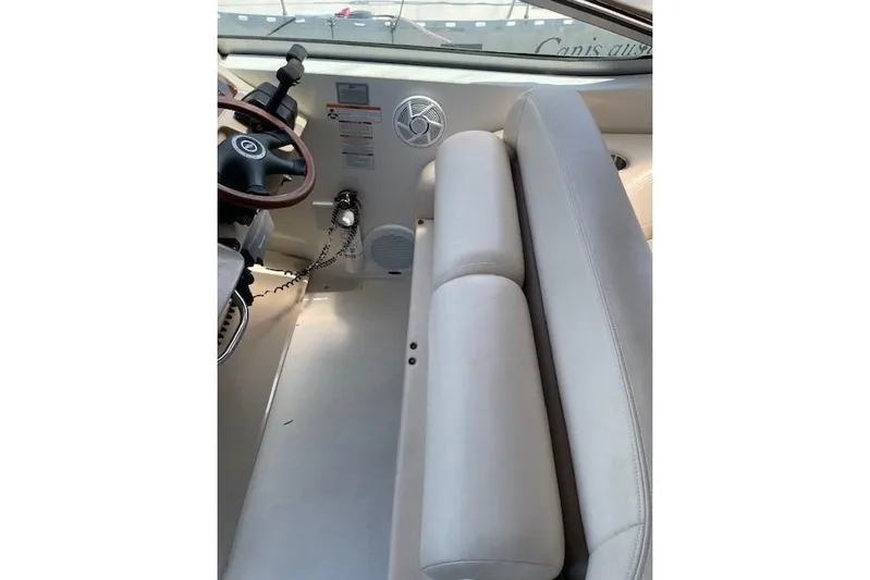 Seahorse Yacht Photos Pics 2007 Chaparral 330 Signature boat interior with steering wheel and seating area.