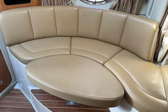 Seahorse Yacht Photos Pics 2007 Chaparral 330 Signature boat interior with tan leather seating and wood flooring.