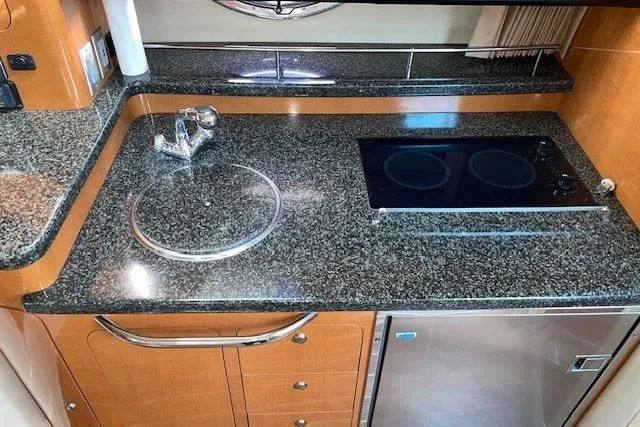 Seahorse Yacht Photos Pics 2007 Chaparral 330 Signature yacht kitchen with granite countertops and modern appliances.
