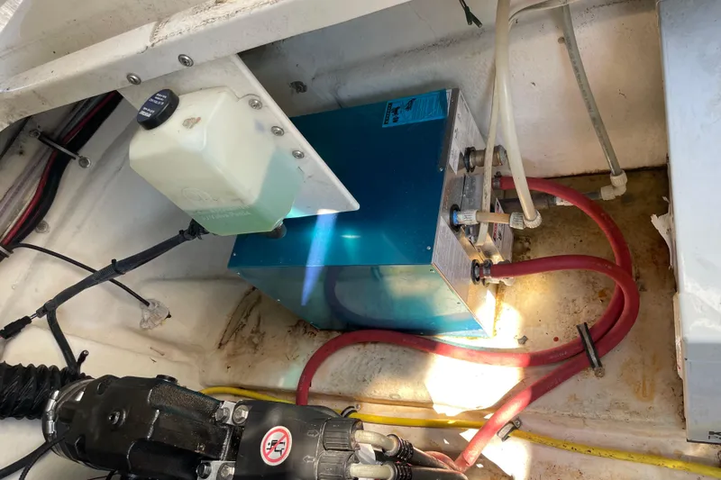 Seahorse Yacht Photos Pics Engine compartment of 2007 Chaparral 330 Signature with visible wiring and fluid container.