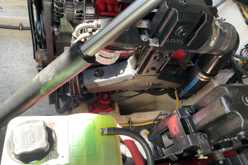 Seahorse Yacht Photos Pics Engine compartment of a 2007 Chaparral 330 Signature boat, showcasing mechanical components.