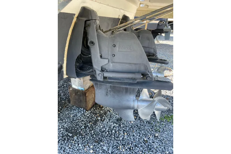 Seahorse Yacht Photos Pics 2007 Chaparral 330 Signature boat propellers on gravel surface.