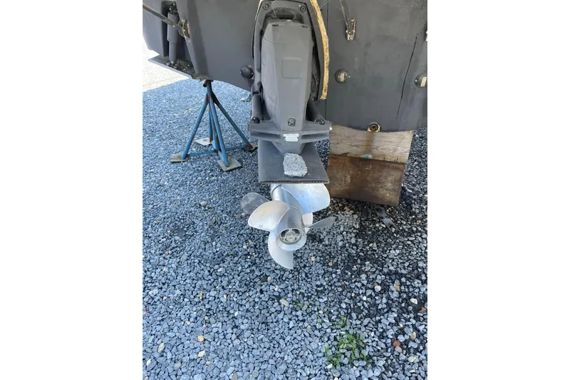 Seahorse Yacht Photos Pics 2007 Chaparral 330 Signature boat propeller on gravel surface.