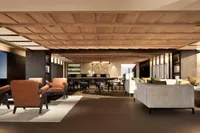Luxurious modern living room with elegant furniture, wooden ceiling, and ambient lighting, 2026 design.