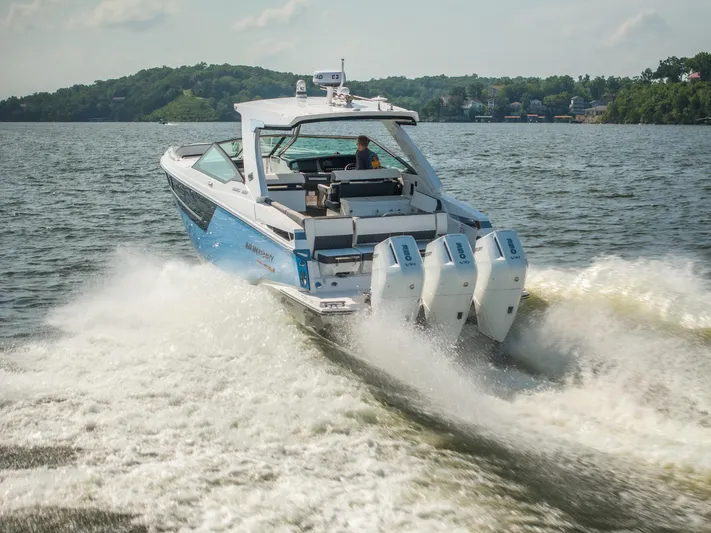  Yacht Photos Pics 2024 Monterey 385SS boat cruising on a lake with powerful outboard engines.