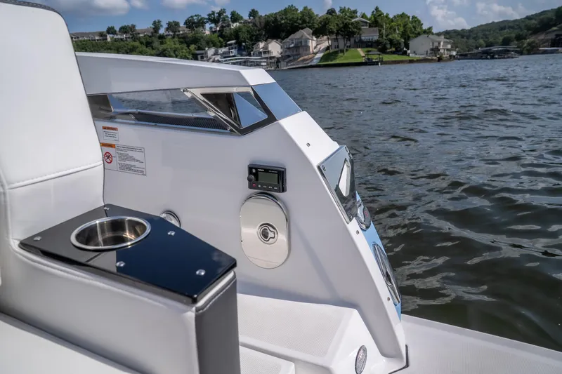  Yacht Photos Pics 2024 Monterey 385SS boat interior with cup holder, control panel, and scenic water view.