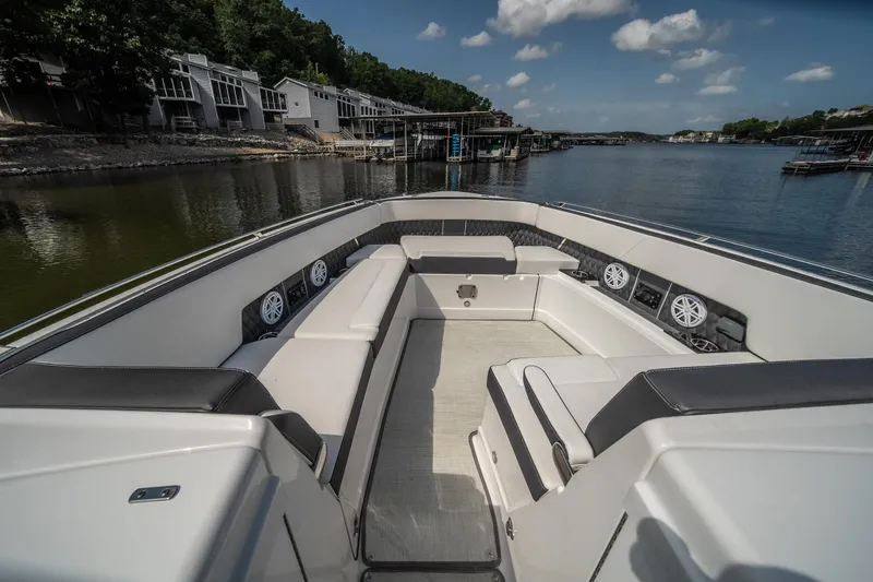  Yacht Photos Pics 2024 Monterey 385SS boat interior with luxurious seating, dockside view, and clear blue sky.