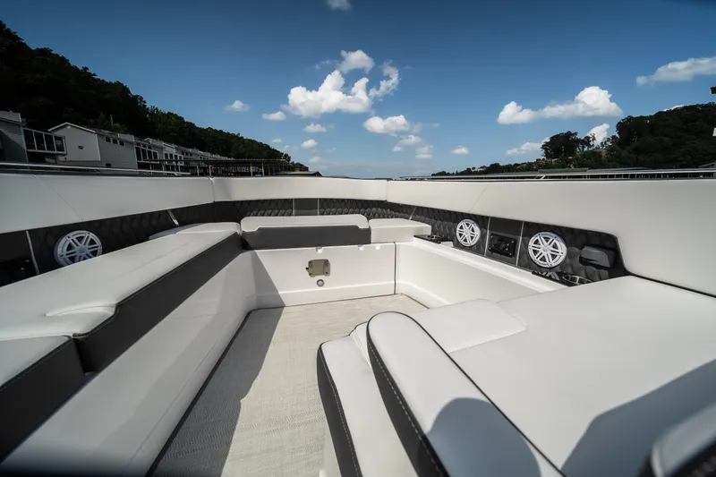  Yacht Photos Pics 2024 Monterey 385SS boat interior with luxurious seating and speakers under a clear blue sky.