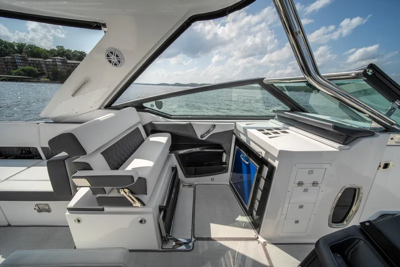  Yacht Photos Pics 2024 Monterey 385SS boat interior with luxurious seating and modern amenities on a sunny day.