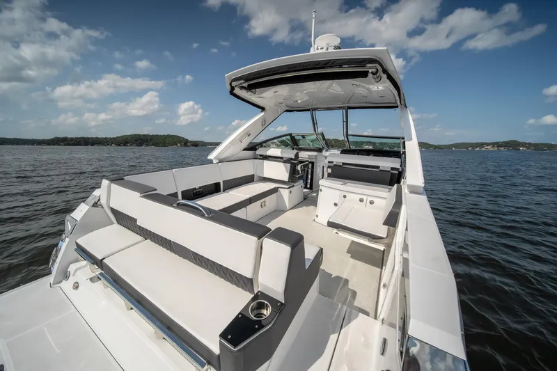  Yacht Photos Pics 2024 Monterey 385SS luxury boat interior with spacious seating on a sunny day.