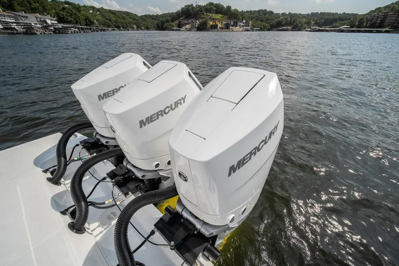  Yacht Photos Pics 2024 Monterey 385SS boat with triple Mercury outboard engines on a lake.