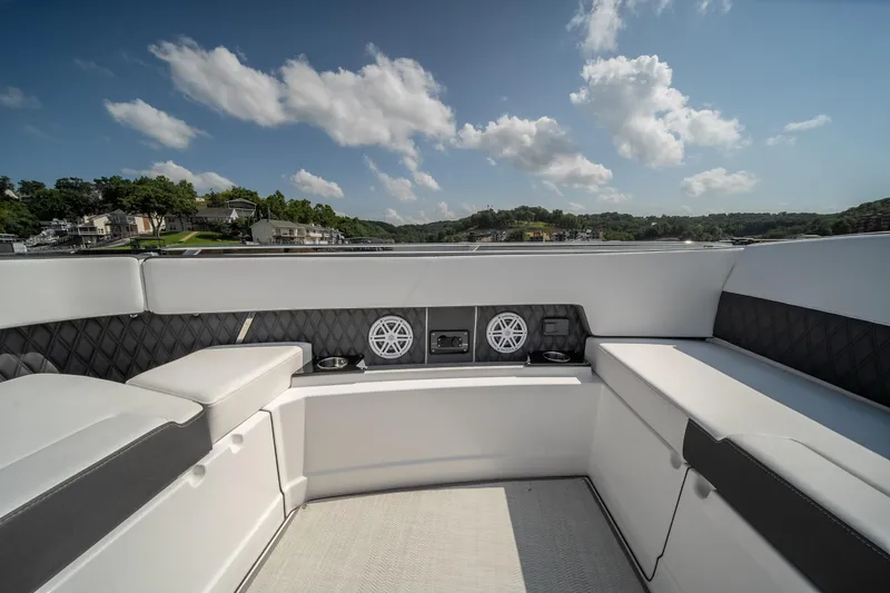  Yacht Photos Pics 2024 Monterey 385SS boat interior with luxurious seating and speakers under a clear sky.