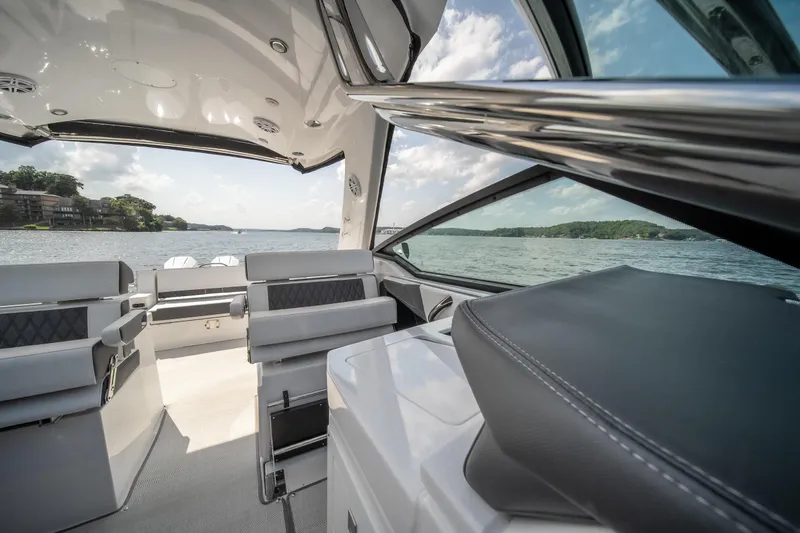  Yacht Photos Pics 2024 Monterey 385SS boat interior with luxurious seating, overlooking a scenic lake view.