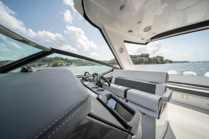  Yacht Photos Pics 2024 Monterey 385SS boat interior with luxurious seating and scenic water view.