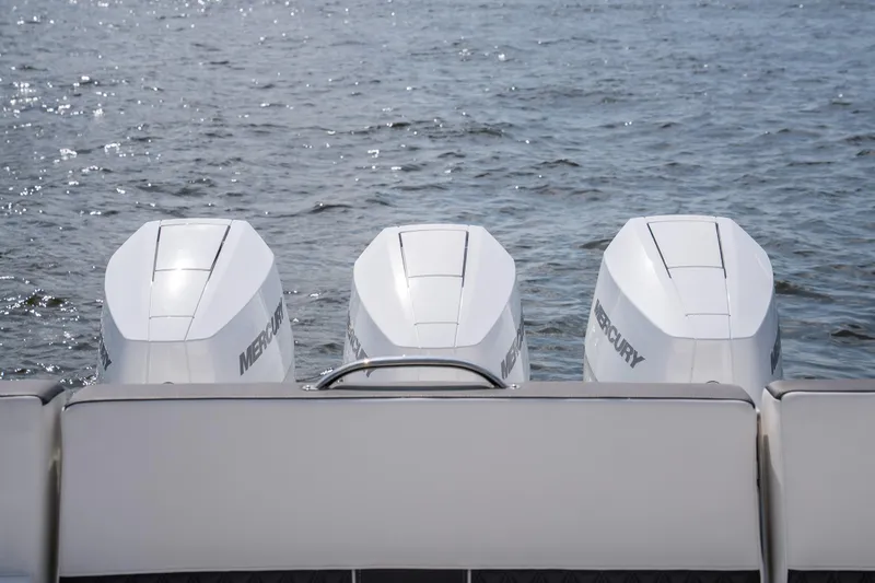  Yacht Photos Pics 2024 Monterey 385SS boat with three Mercury outboard engines on water.