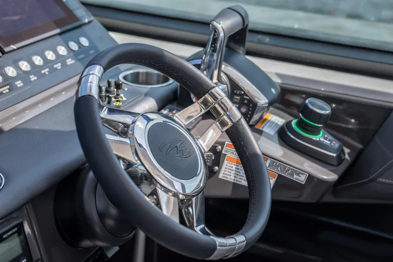  Yacht Photos Pics 2024 Monterey 385SS steering wheel and control panel, showcasing modern design and technology.