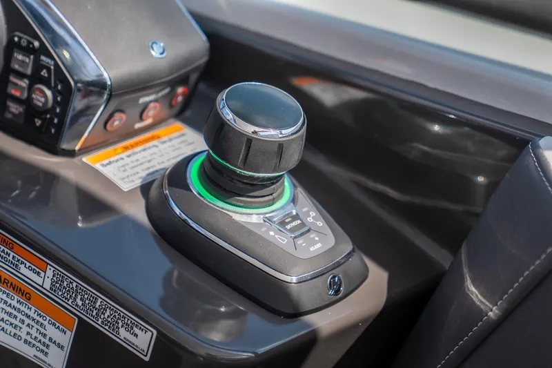  Yacht Photos Pics Control panel of 2024 Monterey 385SS boat with joystick and warning labels.