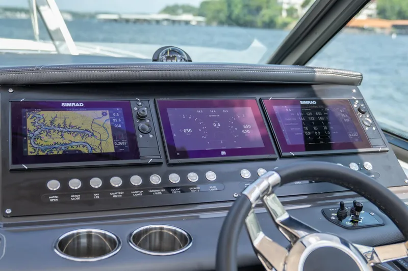  Yacht Photos Pics 2024 Monterey 385SS dashboard with Simrad navigation displays and control panel.
