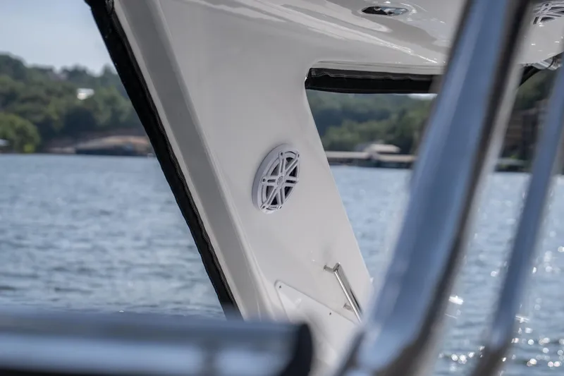  Yacht Photos Pics 2024 Monterey 385SS boat interior with speaker, overlooking serene lake view.
